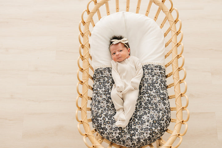 Styled for baby snuggles, this Mebie Baby quilt doubles as an infant muslin blanket with charming plaid and floral design.