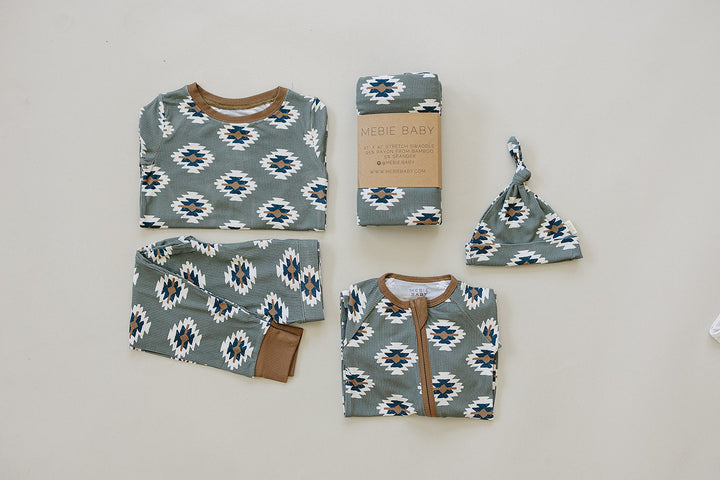 Soft, stretchy, and easy to wear, the Mebie Baby Southwest Aztec Ribbed Bamboo Zipper functions as a relaxed baby onesie