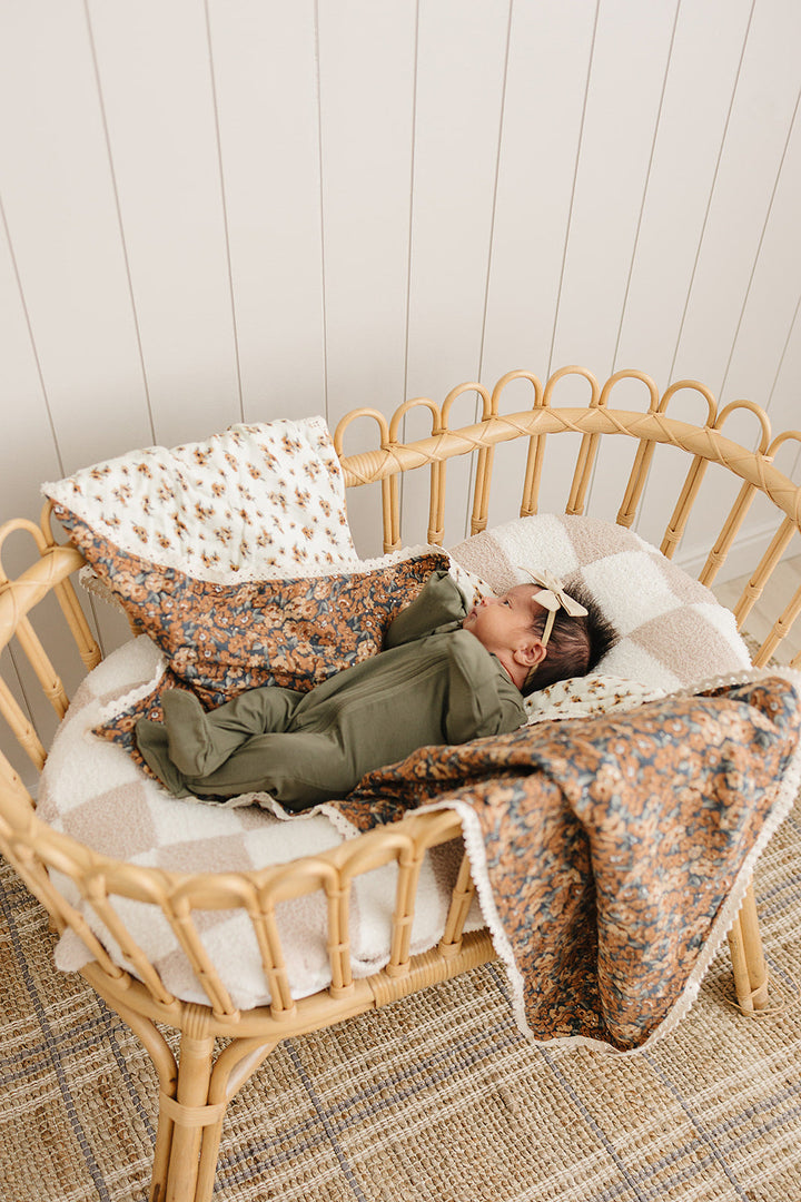 The Mebie Baby Venetian Floral + Autumn Bloom Lace Muslin Quilt is soft and versatile, perfect as a muslin blanket.