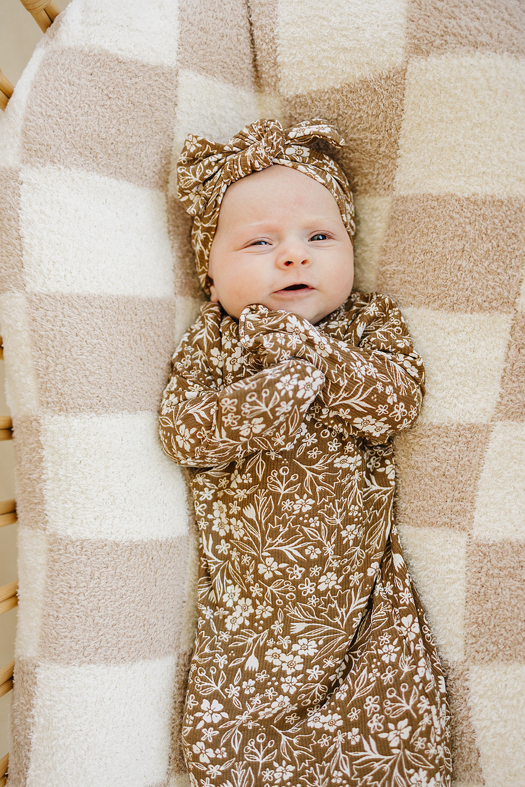 Crafted from ribbed bamboo, the Mebie Baby Brown Floral Knot Gown is an ideal alternative to baby onesies for quick changes