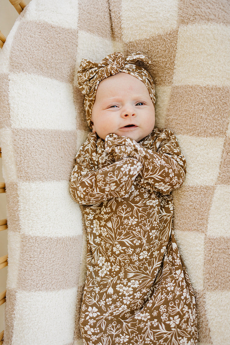 Crafted from ribbed bamboo, the Mebie Baby Brown Floral Knot Gown is an ideal alternative to baby onesies for quick changes