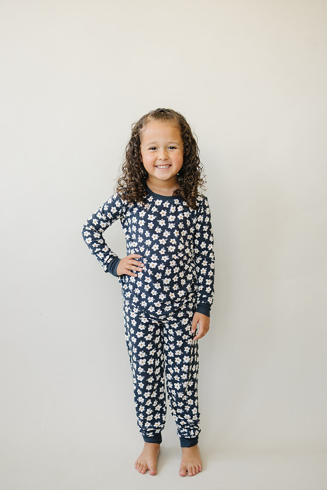 Little ones stay cozy in the Mebie Baby Navy Daisy Ribbed Bamboo Cozy Set, ideal for bamboo baby pajamas