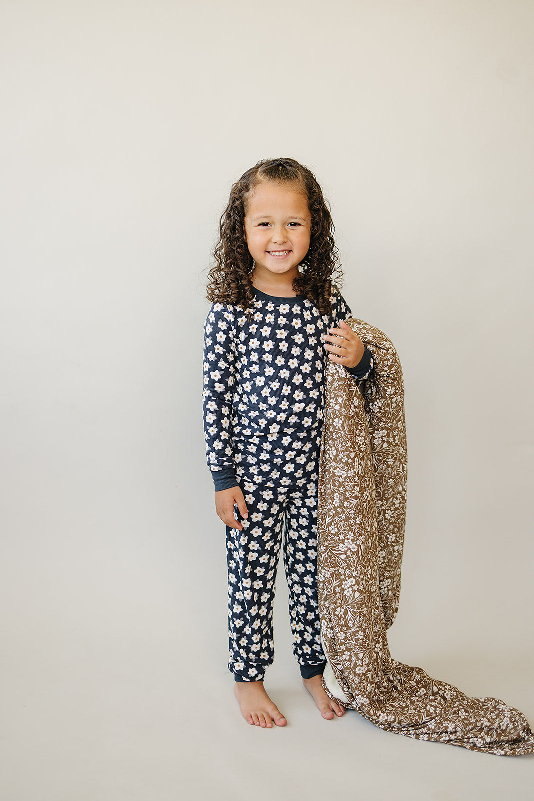 The Mebie Baby Navy Daisy Ribbed Bamboo Cozy Set offers gentle comfort, a top pick in baby bamboo pajamas