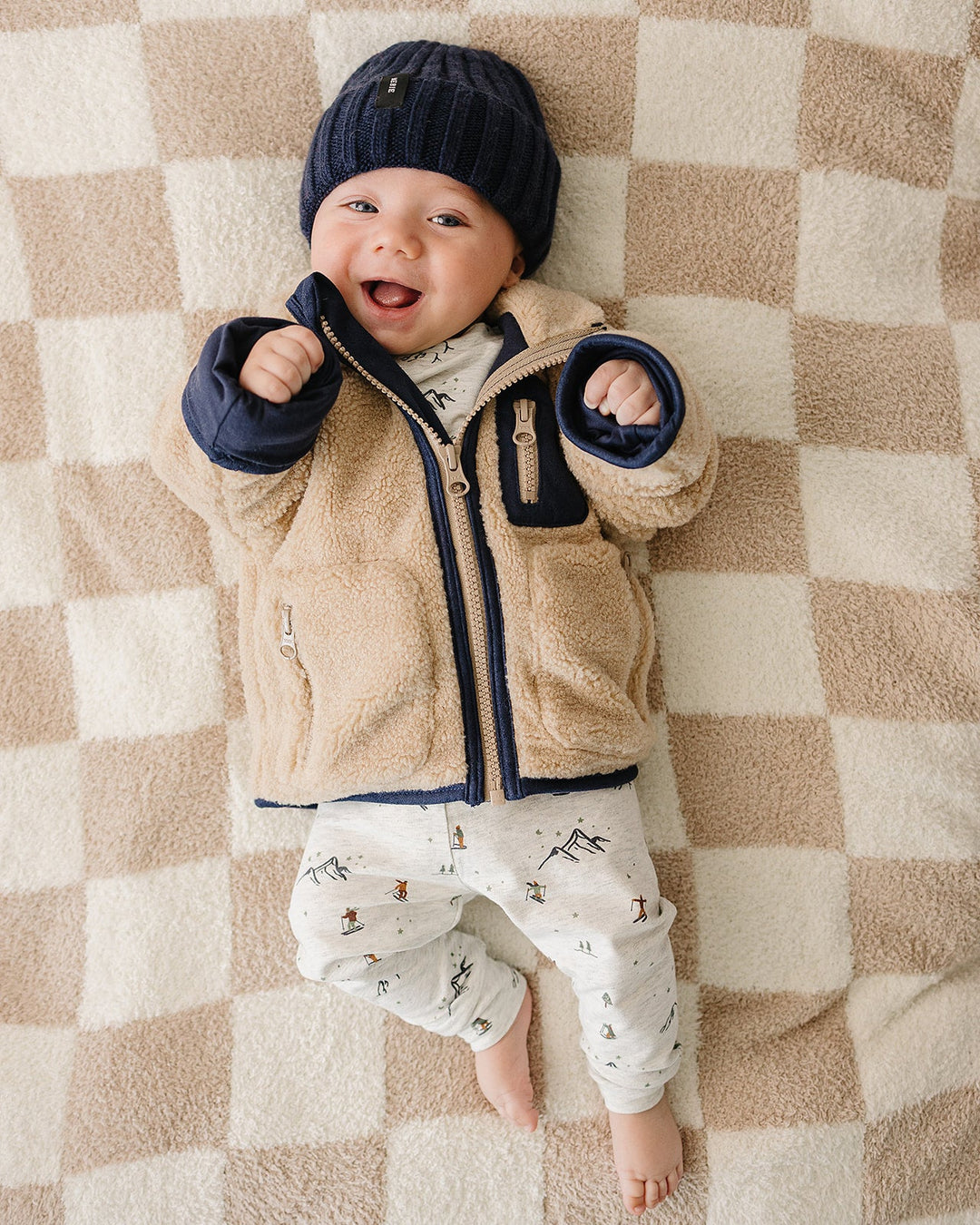 Little ones stay snug in the Mebie Baby Sherpa Zip-Up Jacket, a must-have in best baby clothes