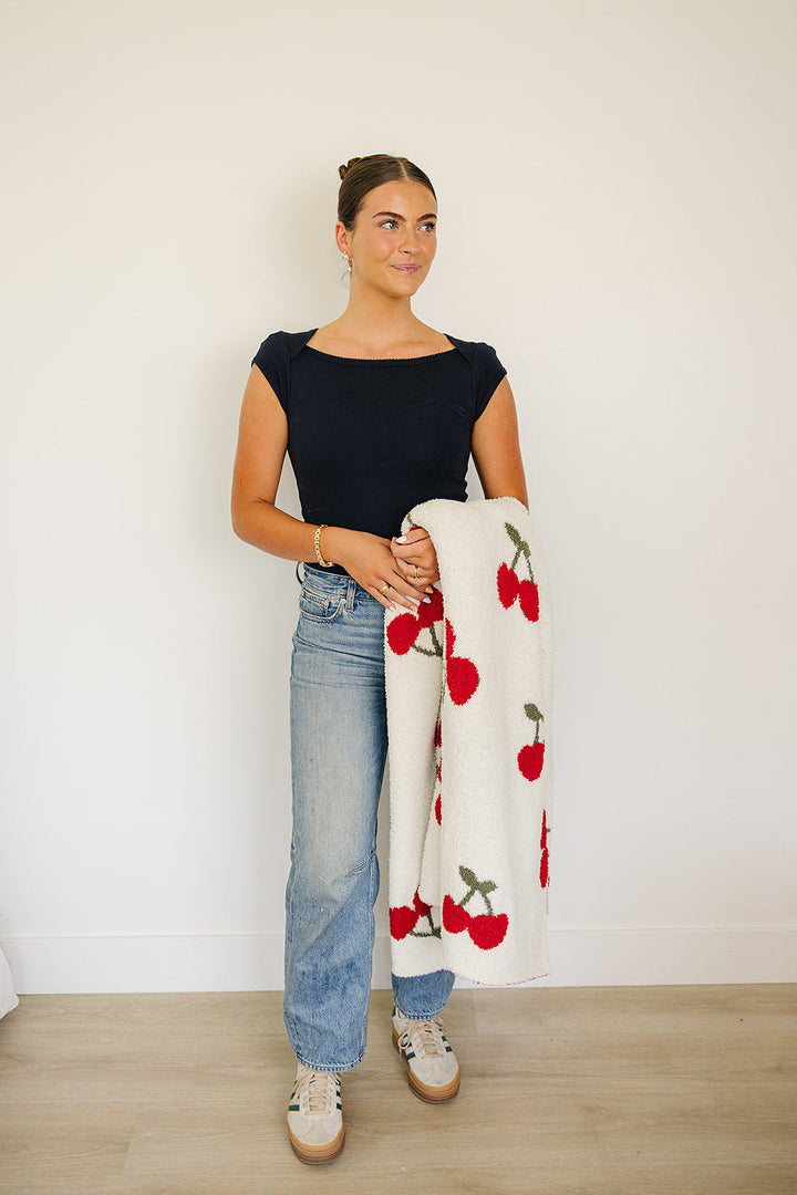 Soft and luxurious, the Mebie Baby Cherry Plush Blanket serves as one of the best baby blankets.