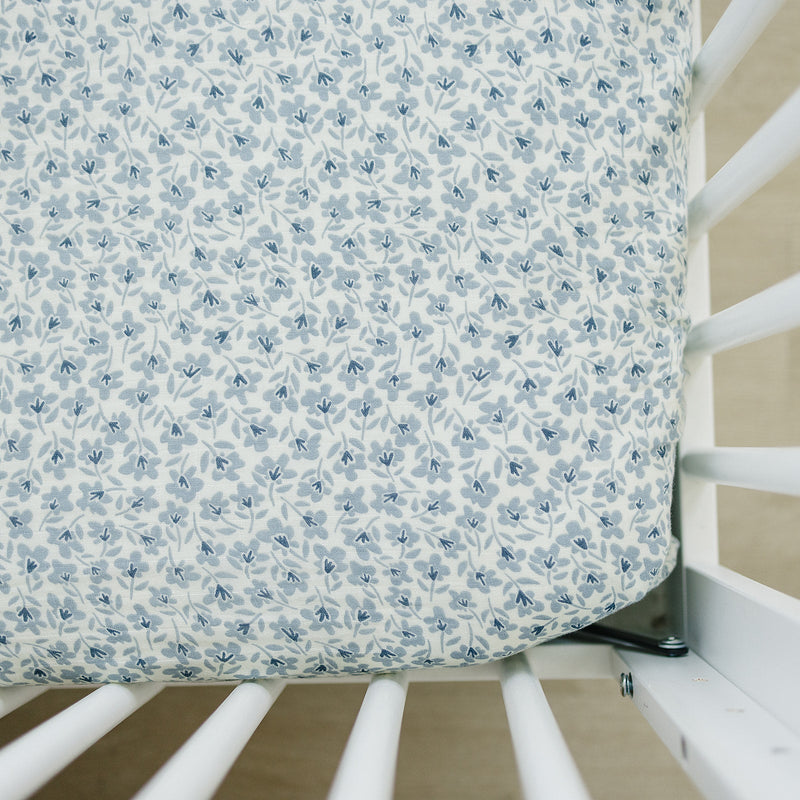 Keep your babyÕs crib cozy with the Mebie Baby Blue Blossom Muslin Crib Sheet, crafted as soft crib sheets.