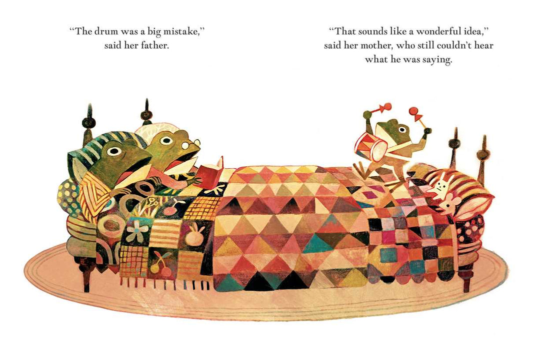 Pokko plays her drum on a patterned rug in this Pokko and the Drum hardcover illustration