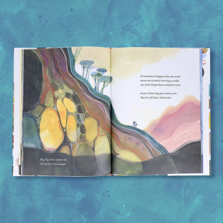 closing illustrated spread of a child holding a treasured rock close to their heart