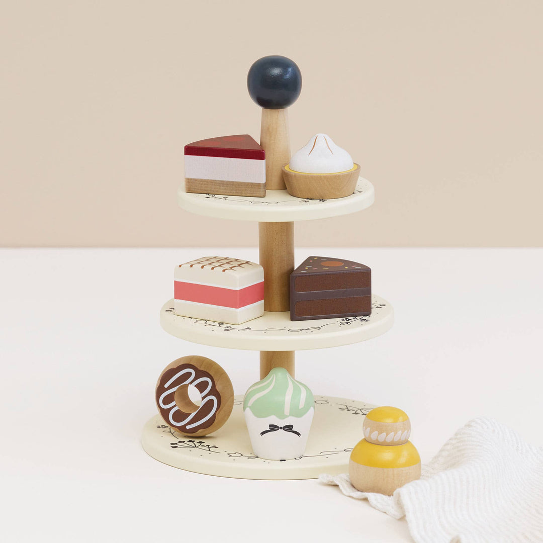 Pretend dessert play with Le Toy Van Wooden Toy Cake Stand & Selection of 7 Eco-Friendly Treats, a kids toy made of wood