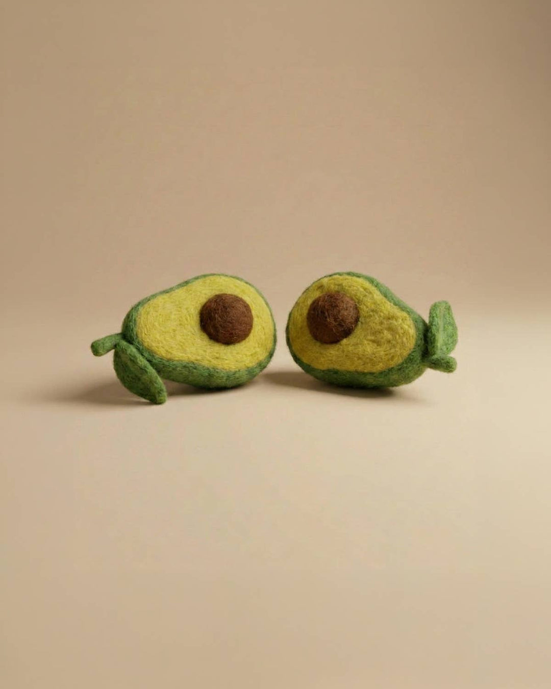 Close-up of Kaddu's Felt Avocado showing handcrafted wool detail