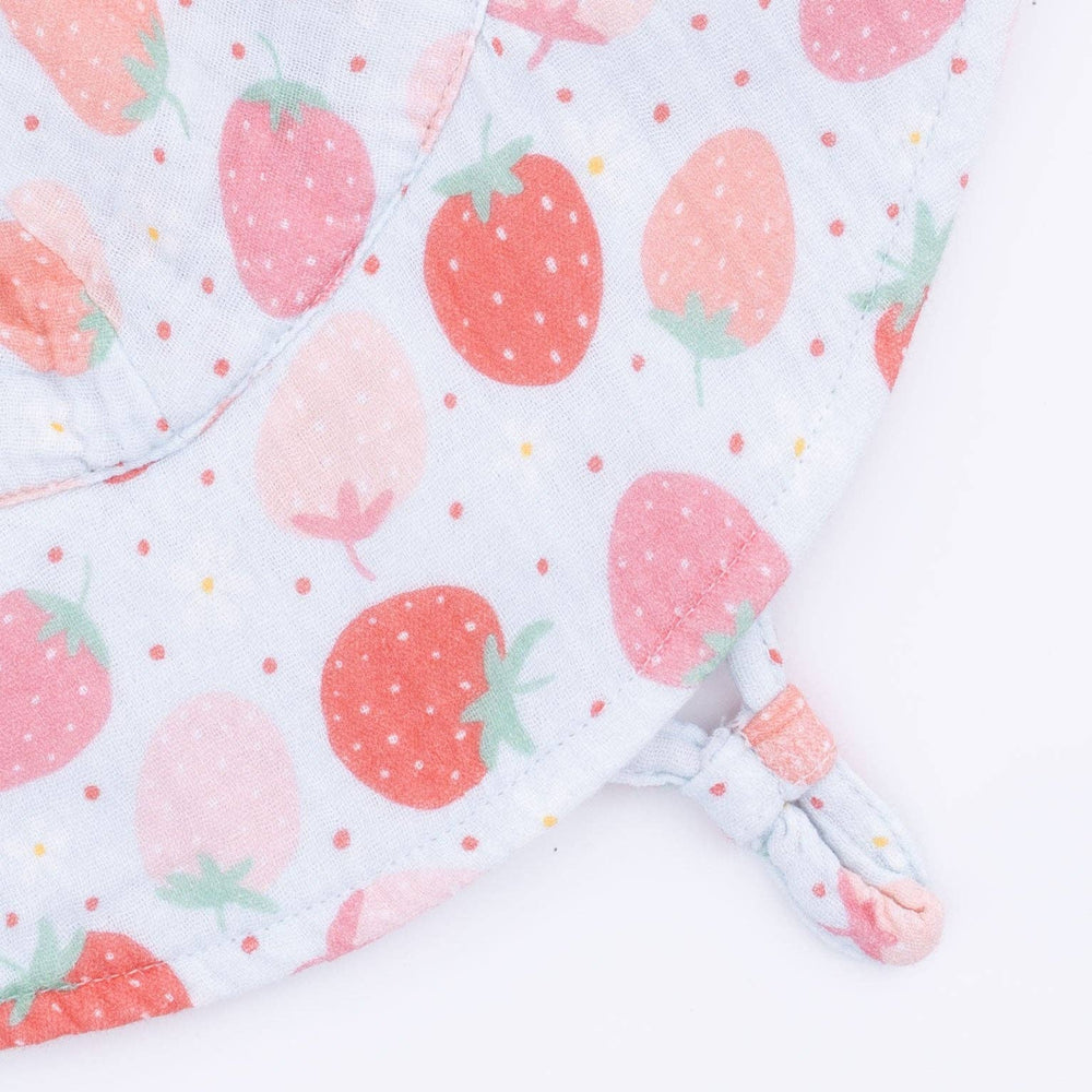close up of angel dear pink strawberry print on baby sun hat 