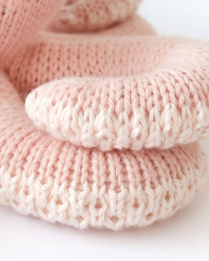 Cuddle + Kind Baby Octopus in Soft Coral Pink, hand-knit octopus stuffed animal for babies