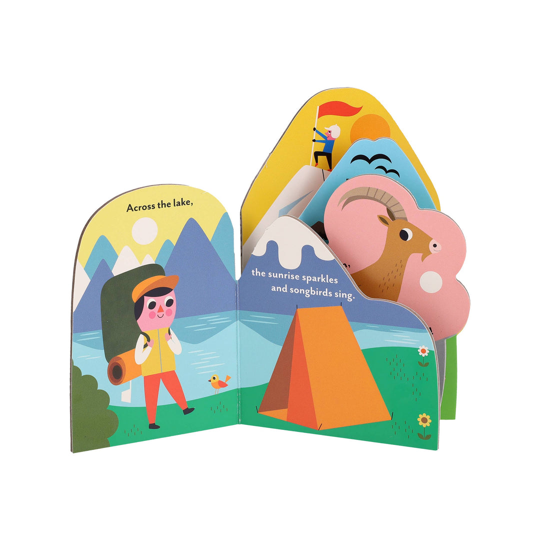 shaped page art of a canoe gliding across a calm forest lake in Ingela P Arrhenius bookscape board book