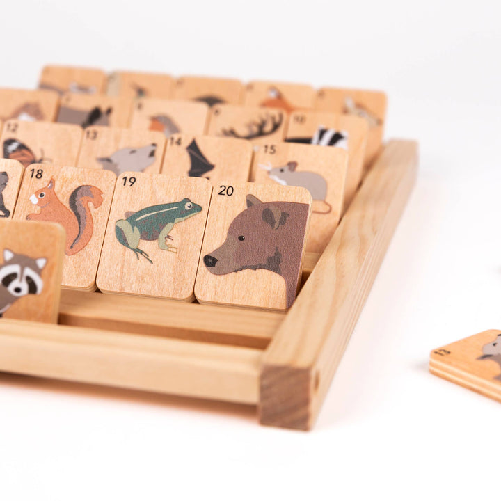 Zoomed in, this Who Am I board from Egmont reveals an animal tile design featuring a raccoon and bear