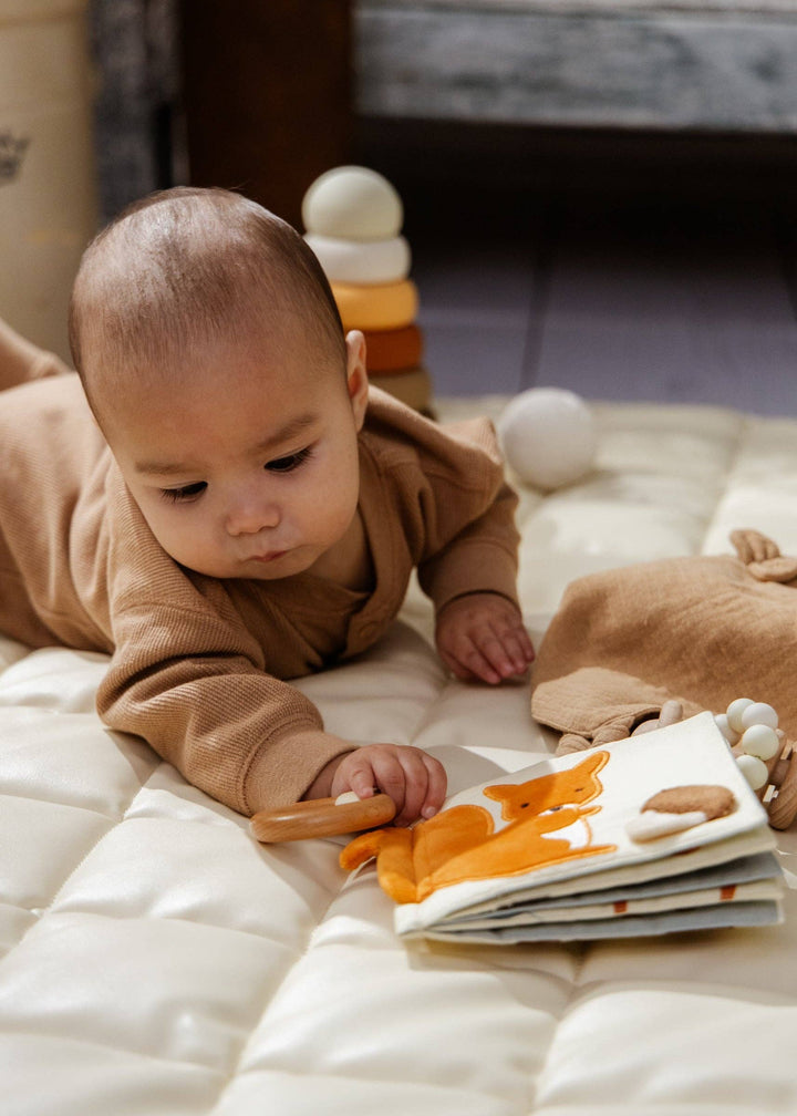 Wrapped in style, the Coco Village Baby First Toys Gift Box is a premium baby gift set that grows with your little one through their first year.