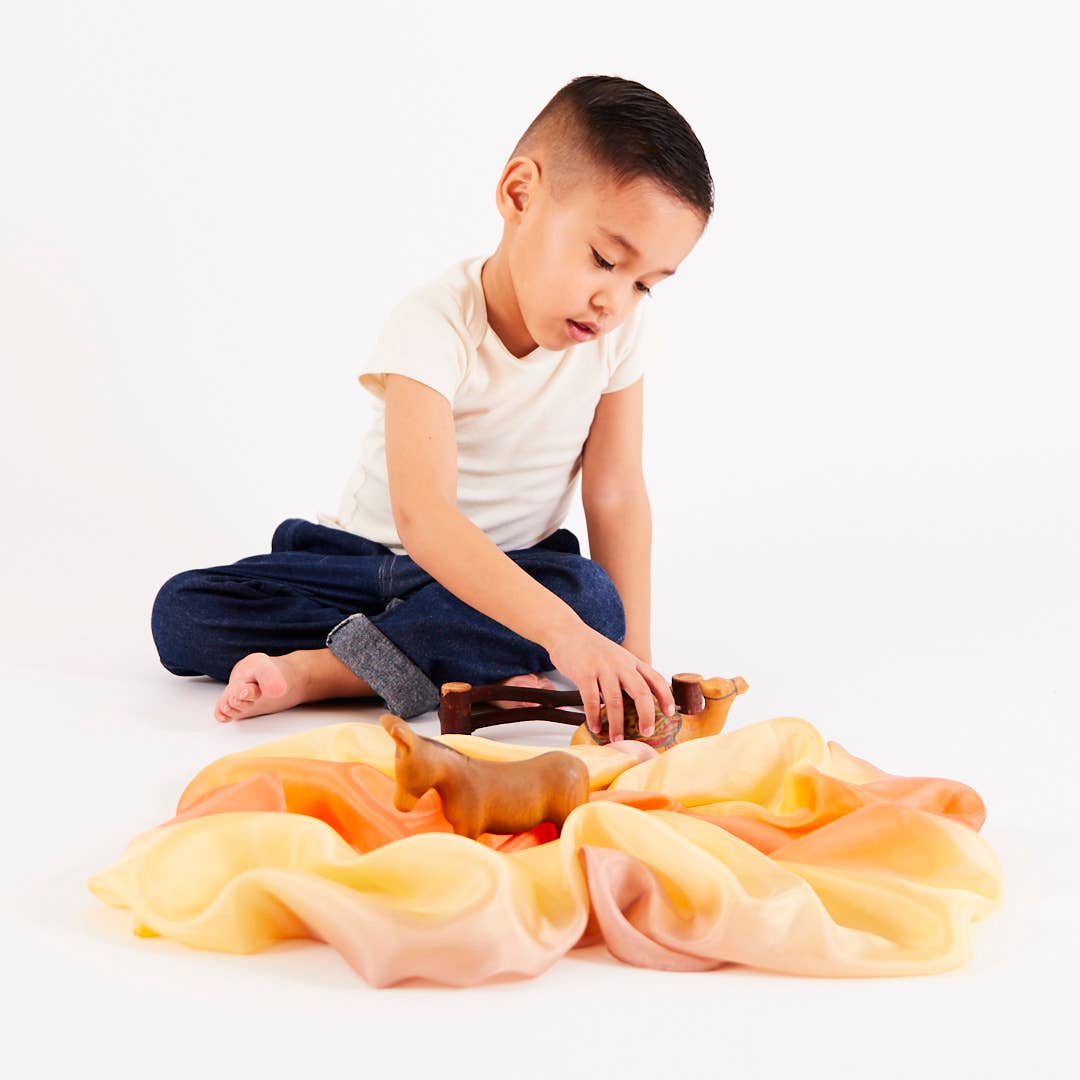 Children adore the Sarah’s Silks Earth Playsilk in Stone for sustainable and creative activities.