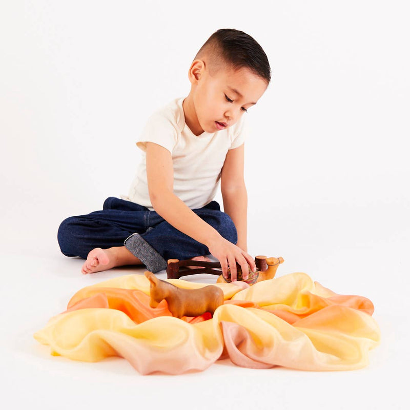 Children adore the Sarah’s Silks Earth Playsilk in Stone for sustainable and creative activities.