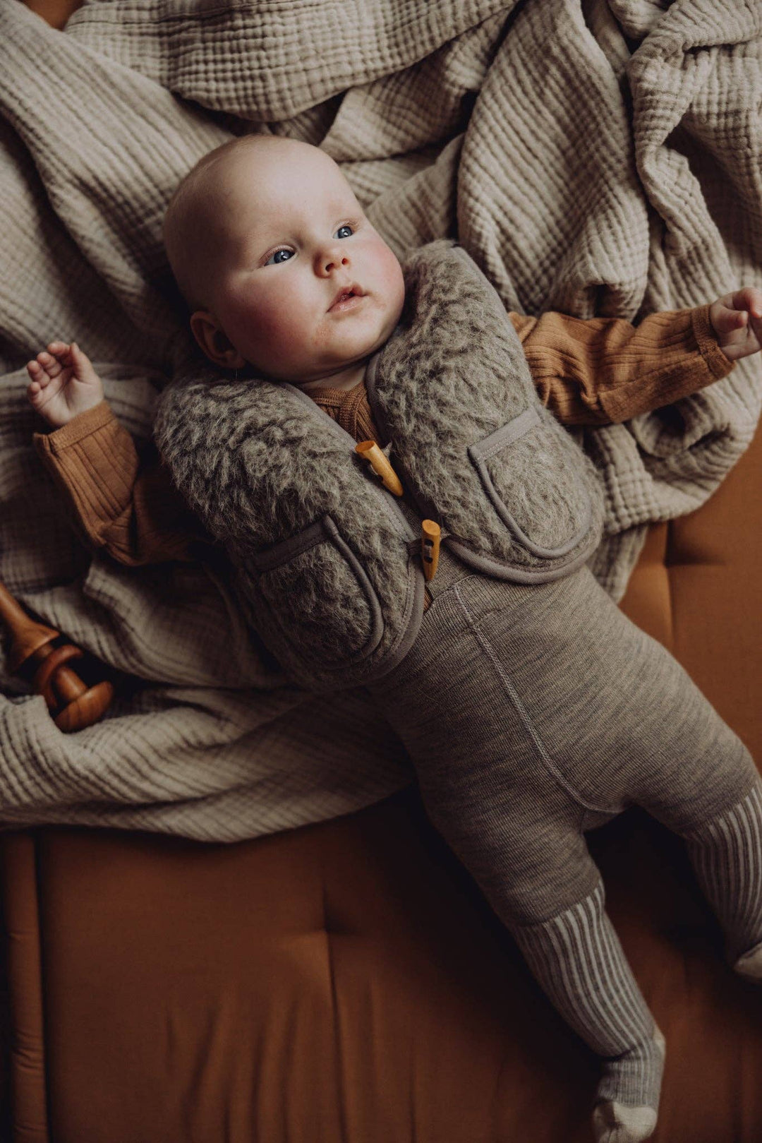 With soft sherpa and a neutral tone, the Finch & Fable Wool Sherpa Vest Ð Sand stands out among cute baby clothes