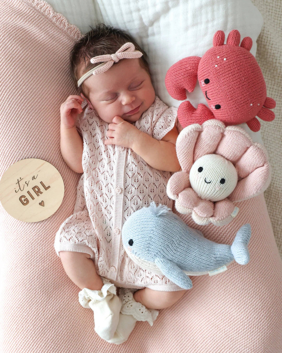 Soft cotton knit crab plush toy Cuddle + Kind Baby Crab, a sweet nursery keepsake