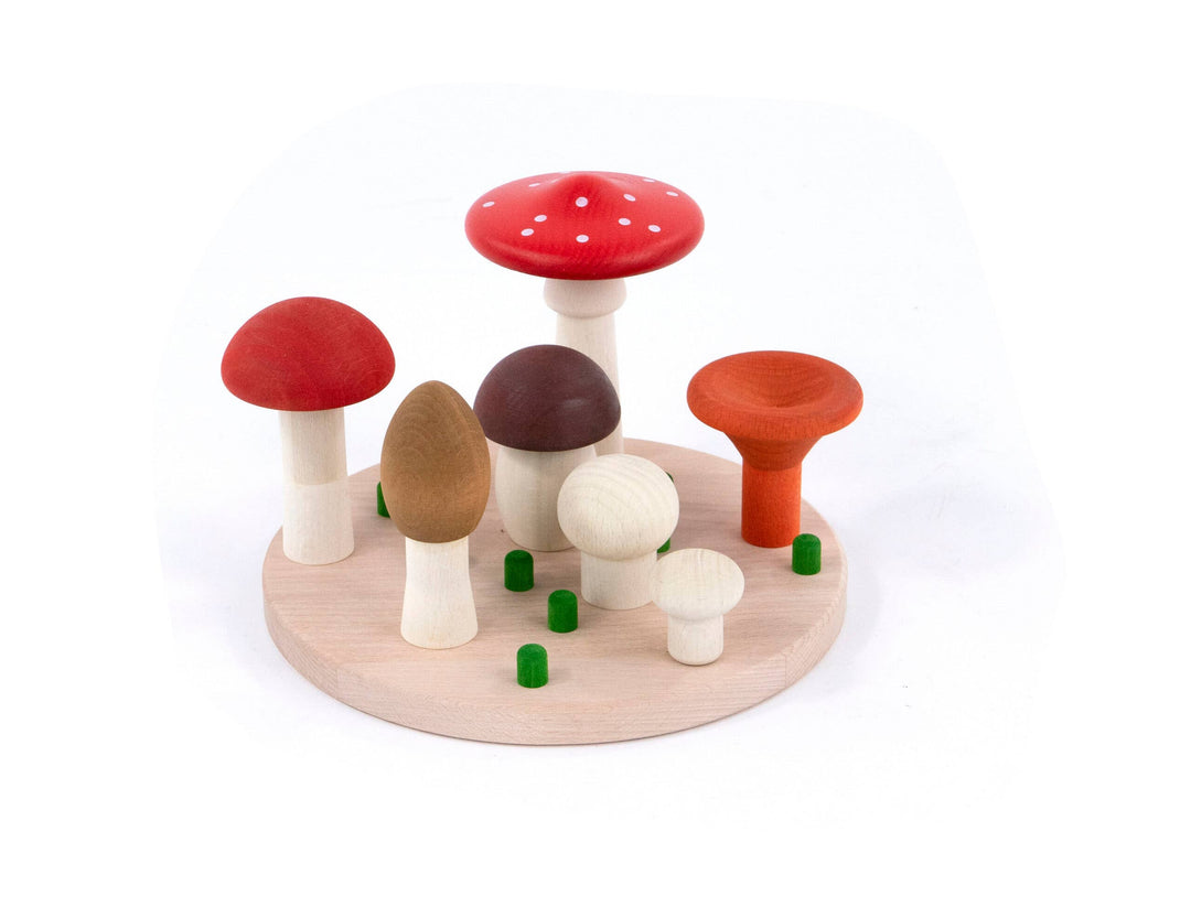 Wooden toadstools in red, brown and cream standing on a round base, Bajo Mushrooms Sorter Montessori style toy for toddlers