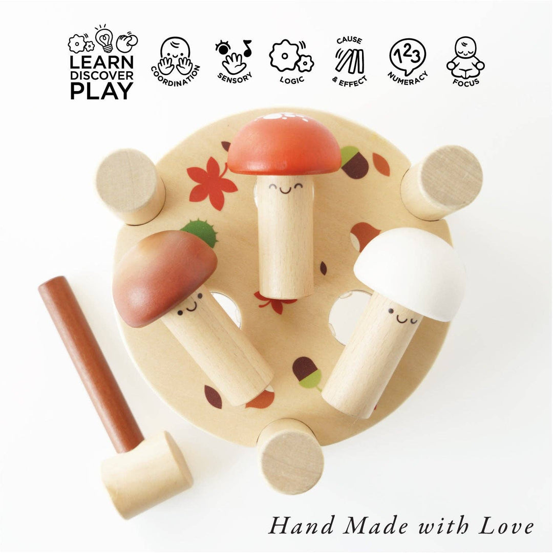 Icons highlighting motor skill benefits accompany the smooth painted pieces of Le Toy Van's Hammer Game