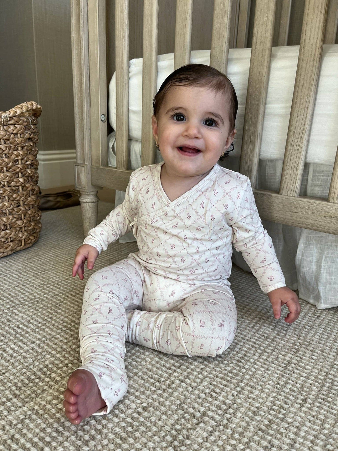 Smiling baby wearing Little Threads mauve bamboo footie, infant sleepwear for cozy nights, sensitive skin, and comfortable baby pajamas