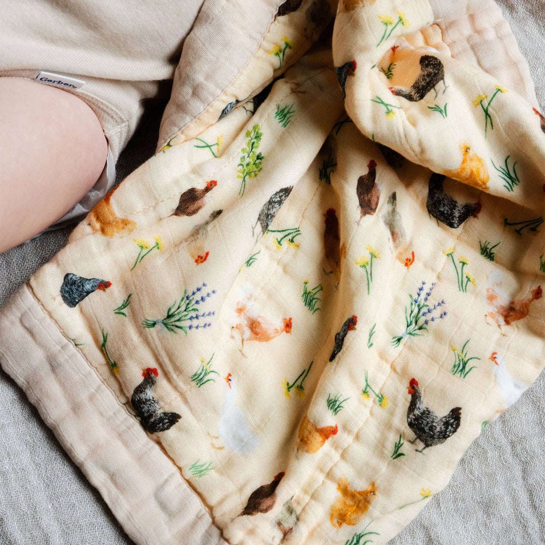 Chicken Meadows muslin baby blanket by 1canoe2, folded to show chicken print pattern for a cozy security blanket
