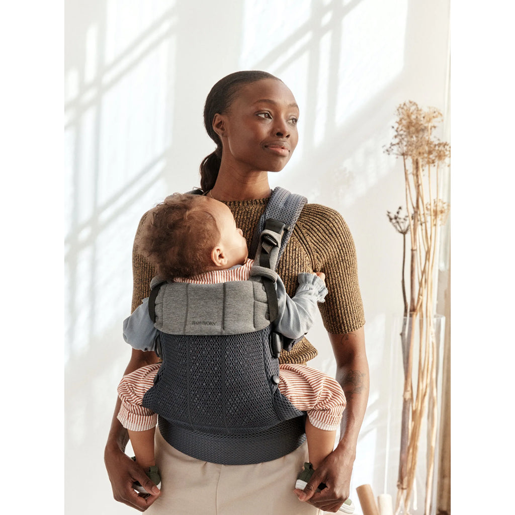 mother wearing baby with carrier babybjorn