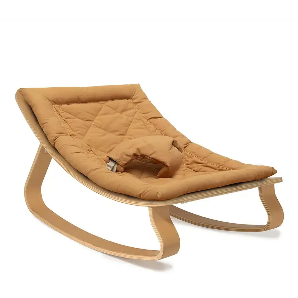 Front angle of the Beech Wood Levo Rocker from Charlie Crane in milk fur, a midcentury modern baby rocker for stylish homes