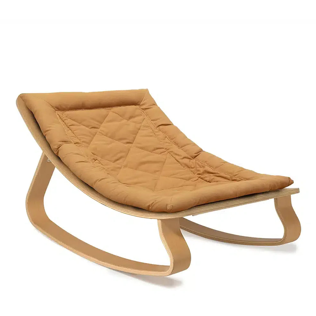 Gentle curves define the Charlie Crane Levo Rocker Beech Wood in mimosa, offering a baby bouncer look with natural materials
