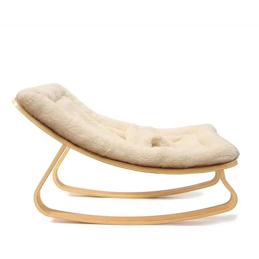 Side profile of the Levo Rocker Beech Wood by Charlie Crane in camel, emphasizing natural rocking motion and baby safe design