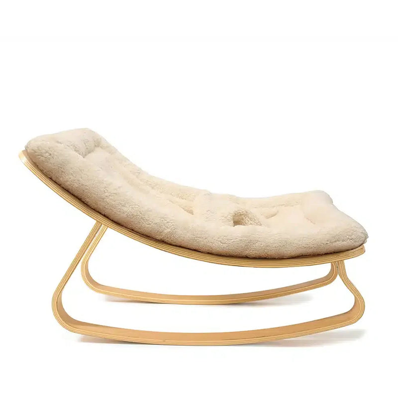 Side profile of the Levo Rocker Beech Wood by Charlie Crane in camel, emphasizing natural rocking motion and baby safe design