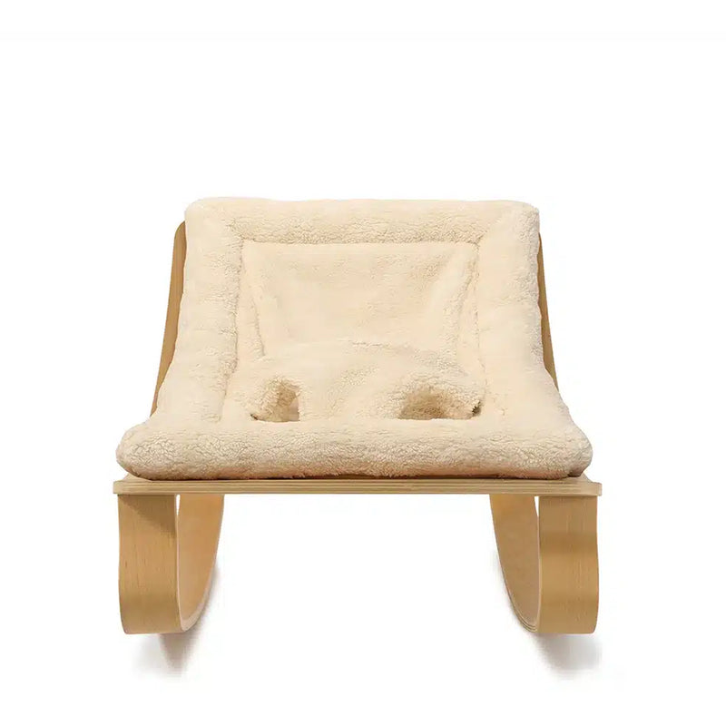 Crafted in beech wood, the Charlie Crane Levo Rocker in milk fur delivers sophisticated French baby seating with comfort