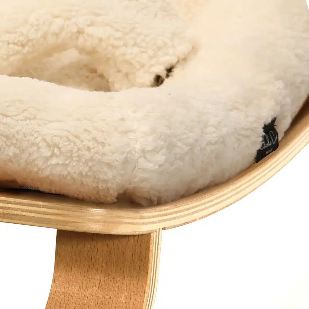 Warm tones of the camel Charlie Crane Levo Rocker in beech wood create timeless nursery decor with a rounded shape