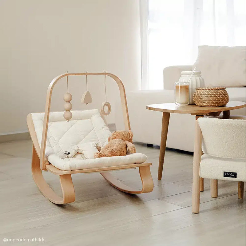 Designed to soothe, the camel Levo Rocker Beech Wood from Charlie Crane offers infant comfort with natural movement