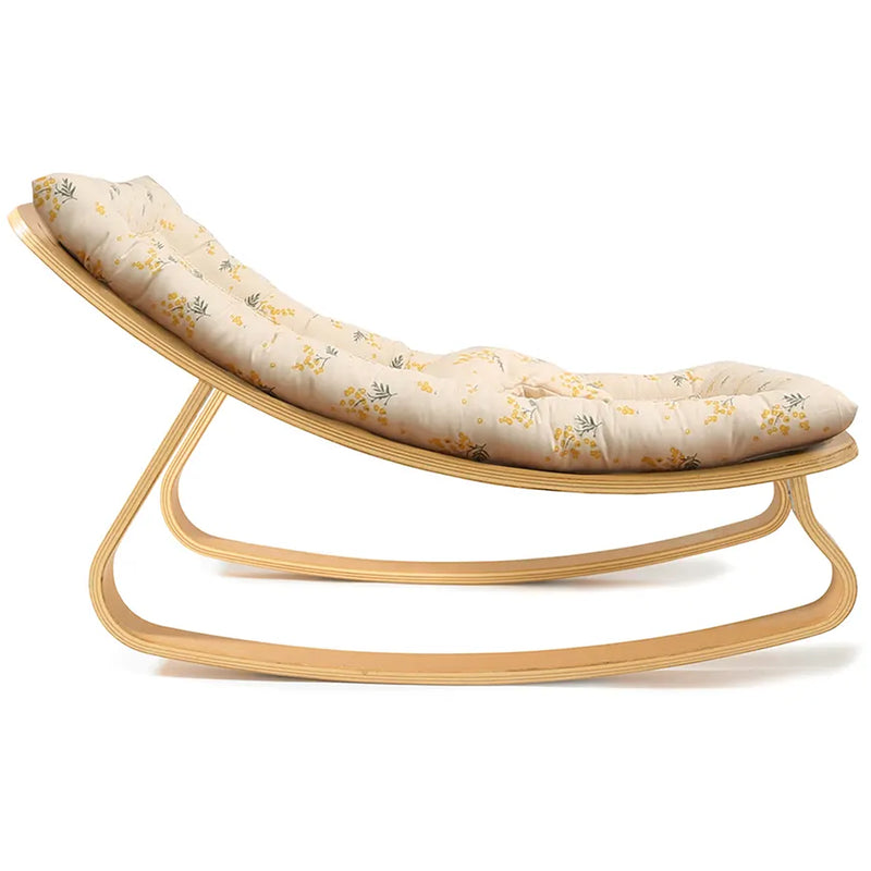 Elegant proportions of the Charlie Crane Beech Wood Levo Rocker in milk fur support a baby bouncer and rocker experience