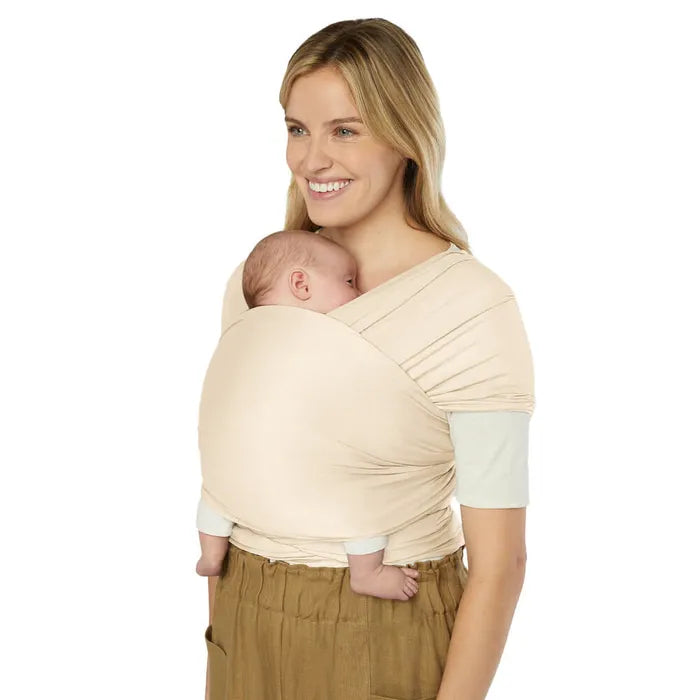 Snuggle your baby in style with the Ergobaby Aura Baby Wrap in Cream, an ideal baby carrier wrap for daily use.