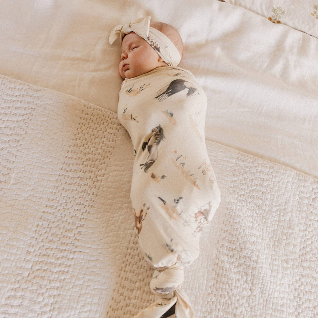 Copper Pearl Montana 46x46 muslin-style knit swaddle blanket in soft gender-neutral tones
