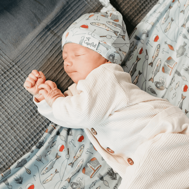 Copper Pearl Trout 46x46 muslin-style knit swaddle blanket in soft gender-neutral tones