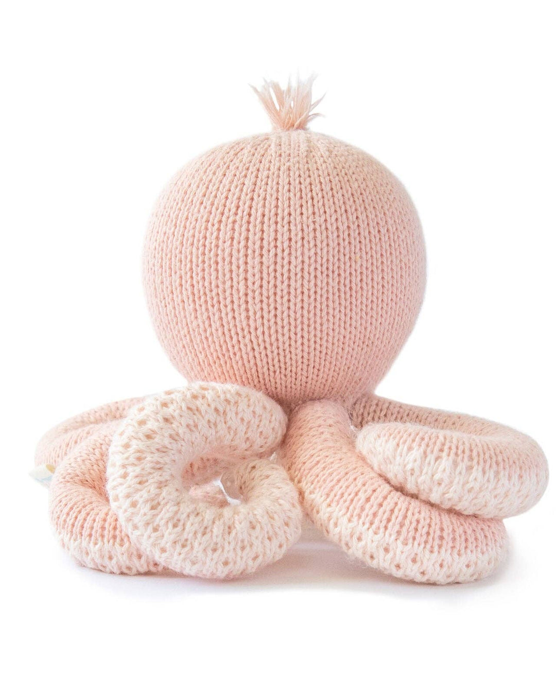 Baby Octopus in Soft Coral Pink from Cuddle + Kind, a hand-knit octopus stuffed animal for baby and toddler cuddles