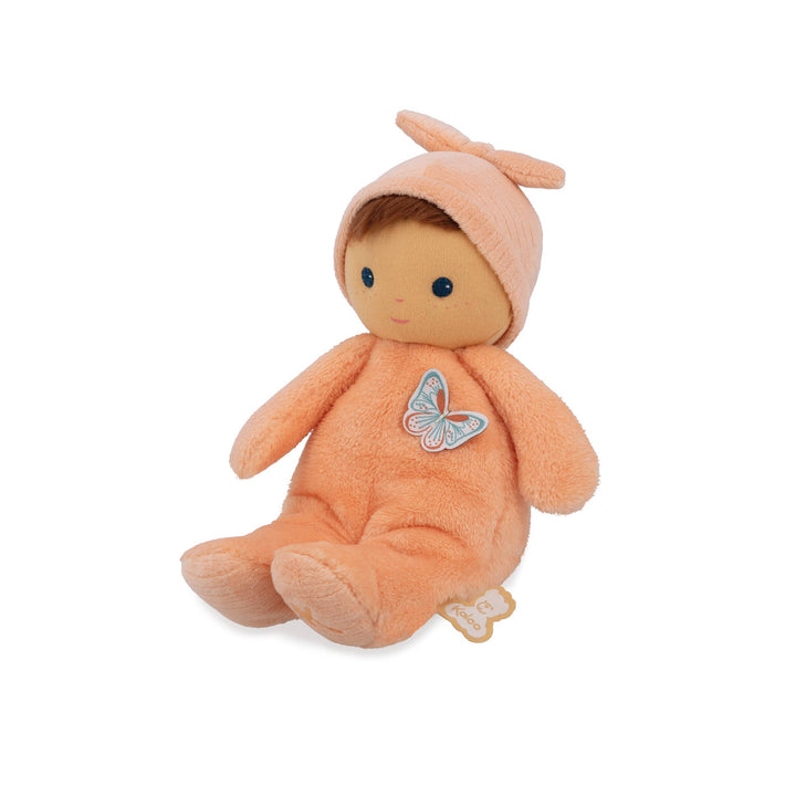 Baby holding Janod Tender Baby Zinnia Doll soft cuddly toy