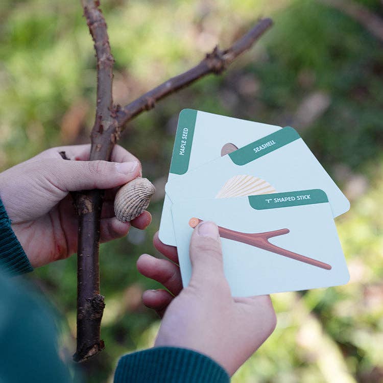 Children playing Huckleberry Scavenger Hunt outdoor game with objects found outdoors