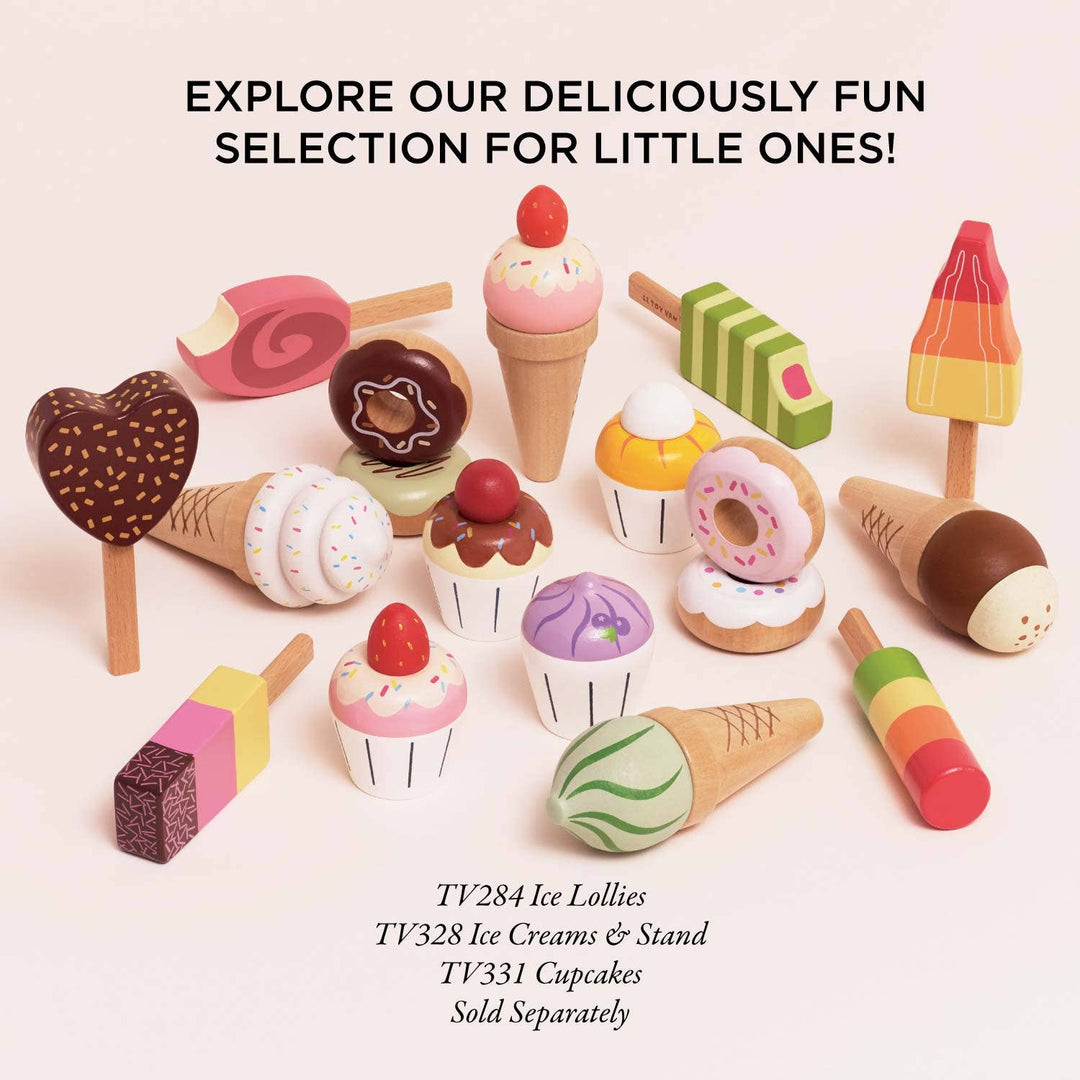 Le Toy Van's Donut Set shown near a spread of other pretend desserts including ice cream and cupcakes