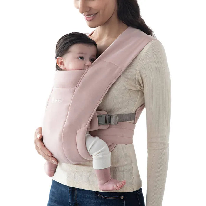 Soft support defines the Ergobaby Embrace Newborn Carrier in Blush Pink, a must-have baby chest carrier.