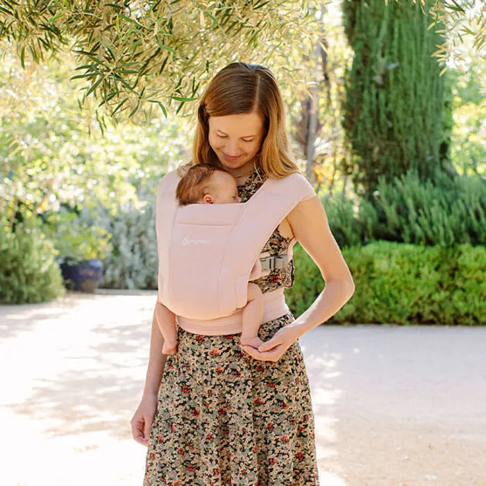 In pretty Blush Pink, the Ergobaby Embrace Newborn Carrier offers everyday comfort as a best baby carrier for newborn.