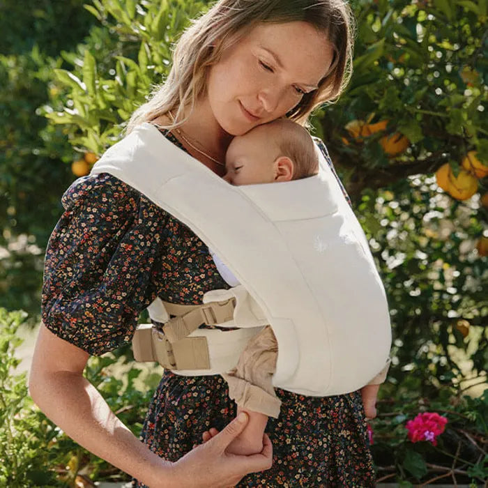 Everyday cuddles feel natural in the Ergobaby Embrace Newborn Carrier, featured in Cream for minimalist style.