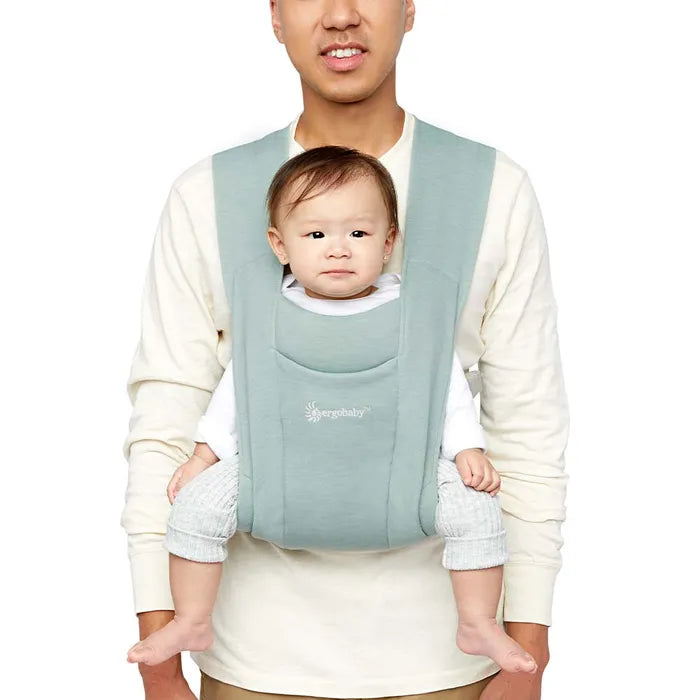 Comfort starts here with the Ergobaby Embrace Newborn Carrier in Jade, a top-rated front baby carrier.