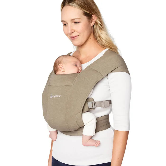 Stay hands-free in the Ergobaby Embrace Newborn Carrier, shown in Olive knit for a soft baby carrier experience.