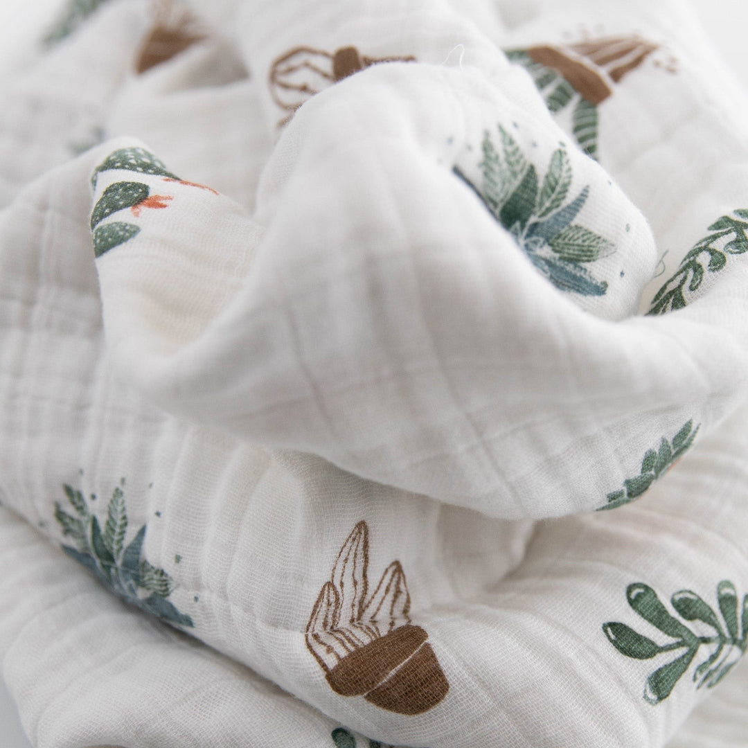 Little Unicorn Cotton Muslin Baby Quilt - Prickle Pots folded neatly, showcasing charming desert design and quality muslin texture.