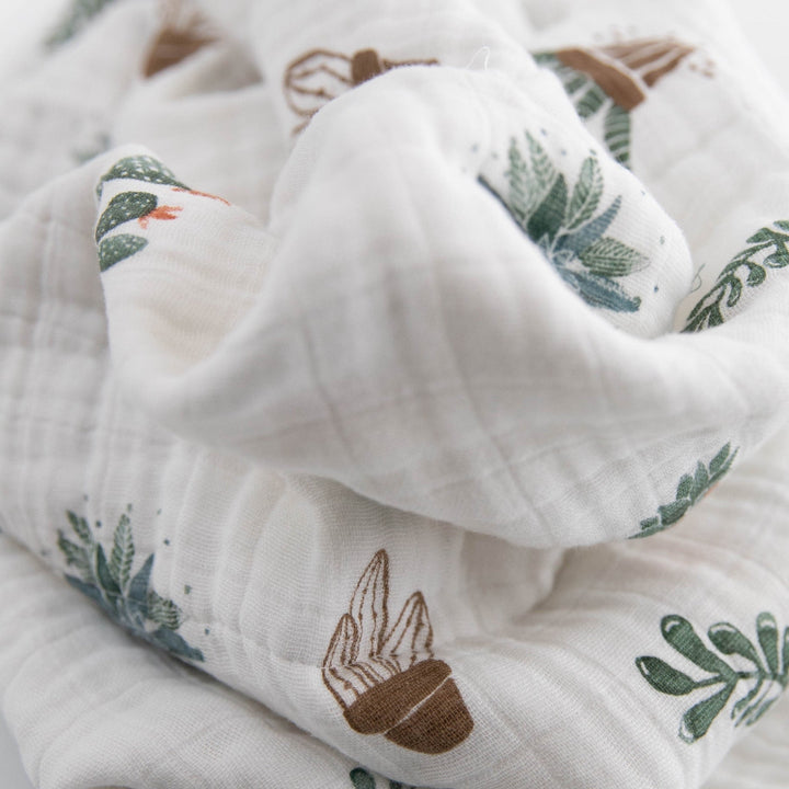 Little Unicorn Cotton Muslin Baby Quilt - Prickle Pots folded neatly, showcasing charming desert design and quality muslin texture.
